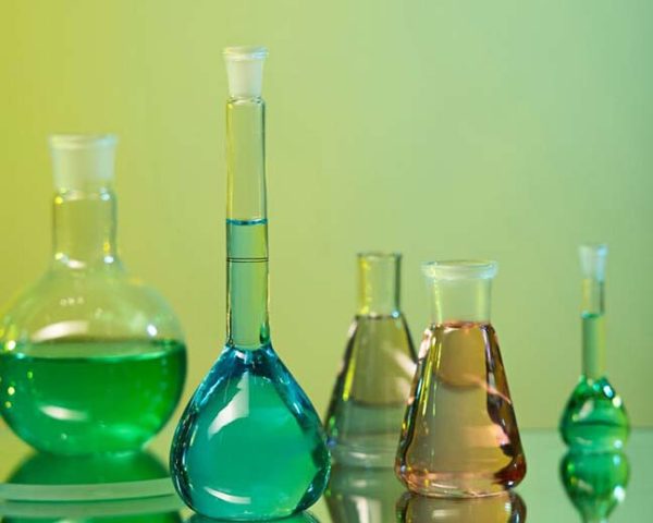 laboratory-glassware-assortment-with-green-background_23-249481721